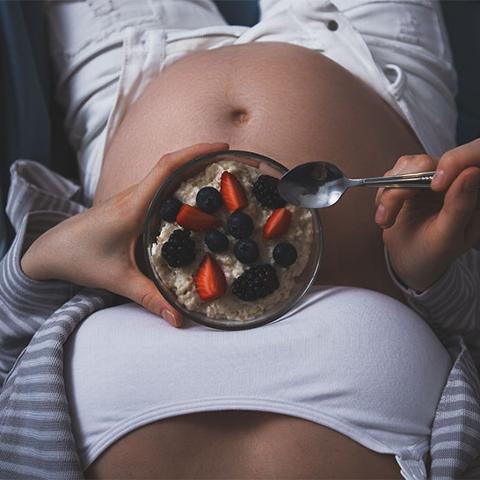 pregnant lady with bowl of food