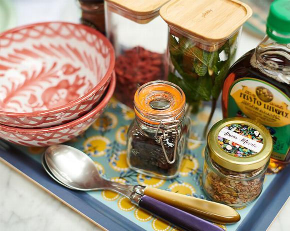 tray with bowls and jars of herbs and honey